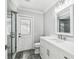 Modern bathroom featuring a walk-in shower, dual sinks, and contemporary fixtures at 8818 Poe Dr, Hudson, FL 34667