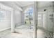 Bright bathroom with soaking tub and separate glass shower and natural lighting at 8818 Poe Dr, Hudson, FL 34667