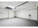 Spacious two-car garage features epoxy flooring and ample storage space at 8818 Poe Dr, Hudson, FL 34667