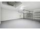 Spacious two-car garage features epoxy flooring and ample storage space at 8818 Poe Dr, Hudson, FL 34667