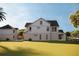 Spacious backyard showcasing a detached garage/guest house and a rectangular swimming pool at 921 12Th N St, St Petersburg, FL 33705