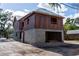 Two-story home under construction featuring an attached garage and durable ZIP system sheathing for weather protection at 921 12Th N St, St Petersburg, FL 33705