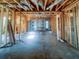 View of framed interior during construction, showcasing exposed wooden beams and windows at 921 12Th N St, St Petersburg, FL 33705