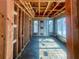 View of framed interior during construction, showcasing exposed wooden beams, windows, and sheathing at 921 12Th N St, St Petersburg, FL 33705
