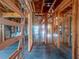 View of framed interior during construction, showcasing exposed wooden beams and windows at 921 12Th N St, St Petersburg, FL 33705
