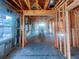 View of framed interior during construction, showcasing exposed wooden beams and windows at 921 12Th N St, St Petersburg, FL 33705