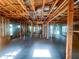 View of framed interior during construction, showcasing exposed wooden beams and windows at 921 12Th N St, St Petersburg, FL 33705