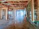 View of framed interior during construction, showcasing exposed wooden beams and windows at 921 12Th N St, St Petersburg, FL 33705