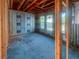 A spacious room is under construction, featuring large windows and unfinished walls at 921 12Th N St, St Petersburg, FL 33705