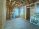 Spacious interior under construction featuring wood framing, natural light from multiple windows, and unfinished flooring at 921 12Th N St, St Petersburg, FL 33705