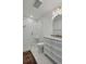 Bright bathroom featuring a glass shower, marble countertops, and a stylish white vanity with gold fixtures at 1112 38Th Ne Ave, St Petersburg, FL 33704