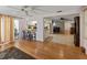 Open floor plan with hardwood floors, lots of natural light, and access to the kitchen at 12202 Meadowbrook Ln, Hudson, FL 34667
