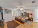 Spacious main bedroom with lots of natural light and a ceiling fan at 12202 Meadowbrook Ln, Hudson, FL 34667
