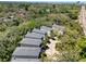 Aerial view of multiple two-story homes showcasing the surrounding landscape and neighborhood highlighting the location at 1353 Curlew Rd, Dunedin, FL 34698