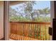 Outdoor balcony offers natural views of lush tree canopy at 1353 Curlew Rd, Dunedin, FL 34698