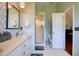 Bright bathroom features a walk-in shower and modern fixtures at 1353 Curlew Rd, Dunedin, FL 34698