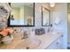 Bright bathroom features a double sink vanity with stylish fixtures and decorative tiling at 1353 Curlew Rd, Dunedin, FL 34698