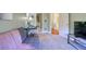 Comfortable bedroom with gray futon, desk space, and doorway leading to other rooms at 1353 Curlew Rd, Dunedin, FL 34698