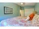 Well-lit bedroom features a comfortable bed and soothing decor at 1353 Curlew Rd, Dunedin, FL 34698