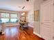 The dining room features wood floors, natural light, and stylish decor, perfect for gatherings and everyday living at 1353 Curlew Rd, Dunedin, FL 34698