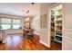 The dining room showcases a spacious pantry, modern lighting, and elegant decor for memorable gatherings at 1353 Curlew Rd, Dunedin, FL 34698