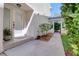 Exterior front door of home is light and bright and leads to covered walkway at 1353 Curlew Rd, Dunedin, FL 34698