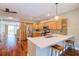 This kitchen is open and bright, featuring stainless appliances and a breakfast bar for easy dining at 1353 Curlew Rd, Dunedin, FL 34698