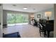 Bright living room with sliding glass doors opening to the backyard at 1353 Curlew Rd, Dunedin, FL 34698