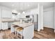 Stylish kitchen featuring white cabinets, granite countertops, and a convenient island with seating at 1453 Otten St, Clearwater, FL 33755