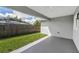 Enjoy the covered patio overlooking the grassy backyard, great for relaxing or entertaining at 1453 Otten St, Clearwater, FL 33755