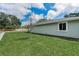 Beautifully landscaped yard with green grass and a view of the home's exterior at 1453 Otten St, Clearwater, FL 33755