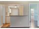 Kitchen and snack bar featuring granite counters and stainless faucet at 1572 84Th N Ave, St Petersburg, FL 33702