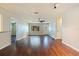 Open floor plan featuring hardwood floors, light walls and a ceiling fan at 1572 84Th N Ave, St Petersburg, FL 33702