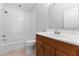 Bathroom with white tile shower and modern fixtures at 1591 Chestnut W Ct, Palm Harbor, FL 34683