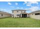 Large backyard featuring lush lawn and patio. Perfect for outdoor living and entertaining with ample space at 17923 Cantarina Cv, Bradenton, FL 34211