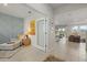Open-concept foyer featuring tile flooring, unique artwork, and easy access to the kitchen and other living areas at 17923 Cantarina Cv, Bradenton, FL 34211