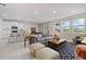 Bright, open living space connects seamlessly with the kitchen, dining area, and living room at 17923 Cantarina Cv, Bradenton, FL 34211