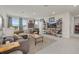 Spacious upstairs living room with multiple windows and sports-themed decor at 17923 Cantarina Cv, Bradenton, FL 34211