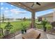 Relaxing screened patio featuring a water view, comfortable seating, and lush landscaping, perfect for enjoying the outdoors at 17923 Cantarina Cv, Bradenton, FL 34211