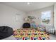 Charming playroom area with colorful rug and ' books and toys at 17923 Cantarina Cv, Bradenton, FL 34211