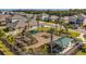 Community playground featuring swings, slides, picnic shelter, set amongst neighborhood homes at 17923 Cantarina Cv, Bradenton, FL 34211