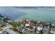 Impressive waterfront home offers private boat access, calm canal, and breathtaking city views at 1827 Venetian Point Dr, Clearwater, FL 33755