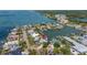 Waterfront home features private boat access, picturesque views, surrounded by lush trees, and a tranquil atmosphere at 1827 Venetian Point Dr, Clearwater, FL 33755