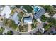 Aerial view of the property showcasing the pool, waterfront access, and surrounding neighborhood at 1827 Venetian Point Dr, Clearwater, FL 33755