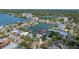 Desirable waterfront home with easy boat access to lake, complemented by verdant surroundings, and city views at 1827 Venetian Point Dr, Clearwater, FL 33755