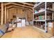 Spacious unfinished attic used for storage; features visible rafters and unfinished wooden floor at 1827 Venetian Point Dr, Clearwater, FL 33755