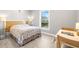Cozy bedroom with a large window and comfortable bed at 1827 Venetian Point Dr, Clearwater, FL 33755