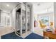 Hallway featuring a residential elevator and views of the water at 1827 Venetian Point Dr, Clearwater, FL 33755