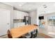 Kitchen with a dining table, white cabinets and stainless steel appliances at 1827 Venetian Point Dr, Clearwater, FL 33755