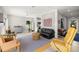Bright living room featuring tile floors, modern furniture, and an open floor plan at 1827 Venetian Point Dr, Clearwater, FL 33755